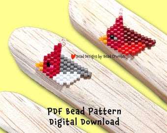 Puede incluir: Dos pendientes de cuentas con forma de pájaro, uno rojo y otro rojo y gris, con picos amarillos, descansan sobre palitos de madera sobre un fondo amarillo. El texto "PDF Bead Pattern Digital Download" está debajo. El texto "bead designs by bead Crumbs" también es visible.