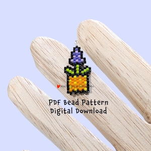 May include: A PDF bead pattern for a small potted flower with purple, green, orange, and black beads. The pattern is a digital download.