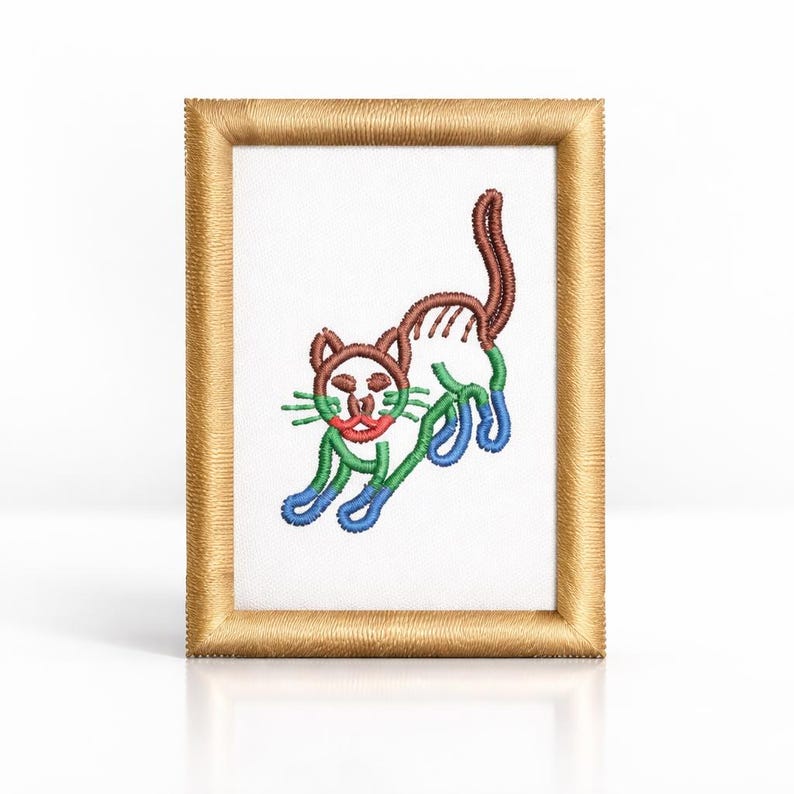 May include: A framed embroidery of a cat in a playful pose. The cat is stitched with brown, green, red, and blue thread. The rectangular frame is gold-coloured. The cat's tail is arched.