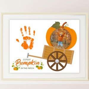 May include: A framed print featuring a handprint and a photo inside a pumpkin. A wooden cart and the text "Cutest Pumpkin in the Patch" are also included. The image is set against a white background.