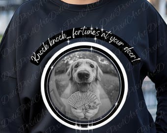 May include: Black sweatshirt featuring a black and white image of a Golden Retriever holding cash. The image is inside a white and black circle, with the text "Knock knock... fortune's at your door!" above it.