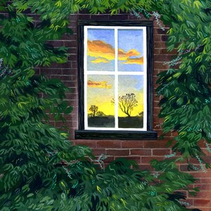 May include: A brick wall with a window showing a sunset reflected in the glass. The window is framed in dark wood and is partially obscured by green leaves.