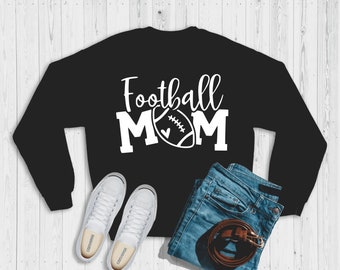 May include: Black sweatshirt with white text that reads "Football Mom" and a white football graphic with a heart.