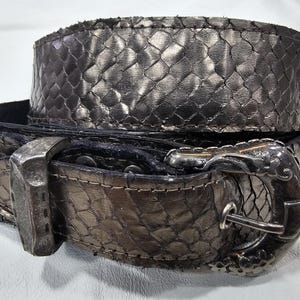 Genuine Snakeskin and Leather Belt with a Unique Buckle. Pewter Colored Whip Snake Lined with Genuine Black Cowhide Leather.