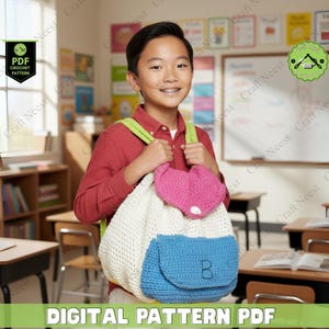 May include: A crochet backpack with a white body, blue pocket, and pink heart-shaped top flap. The backpack is held by a person in a red shirt. The image includes text that says "DIGITAL PATTERN PDF".