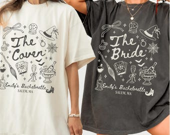 May include: Two oversized t-shirts, one cream and one charcoal gray, featuring black graphic prints. Designs include a witch hat, crystal ball, broom, champagne bucket, and text reading The Coven, The Bride, and Emily's Bachelorette, Salem, MA.