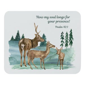 May include: A light blue coaster with a watercolor illustration of a deer family in a forest setting. The text reads, "How my soul longs for your presence! Psalm 42:1."