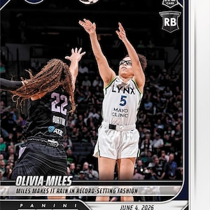 May include: A Panini Instant basketball trading card featuring Minnesota Lynx player Olivia Miles in a white jersey with the number 5, shooting a basketball. The card includes the text Rookie RC, Record Breaker RB, and Miles Makes It Rain.