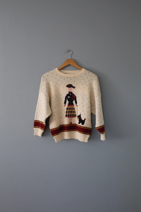 girl walking scotty dog sweater