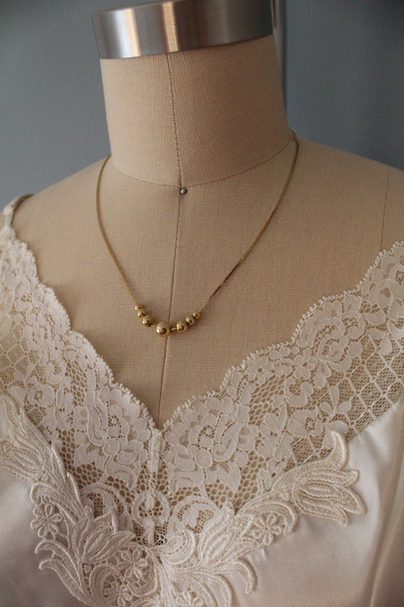 vintage golden balls necklace | 1970s delicate sna