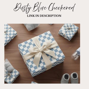 May include: Dusty blue checkered gift boxes with cream-colored bows, baby shoes, and a bottle on a wooden surface. The boxes have a light blue and white checkered pattern. Text reads "Dusty Blue Checkered" and "Link in Description".