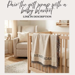 May include: A beige baby blanket with vertical stripes and the name "HENRY NOAH" in black lettering is draped over a wooden crib. The blanket has a fringed edge with multiple colors. The image includes text that says "Pair the gift wrap with a baby blanket".