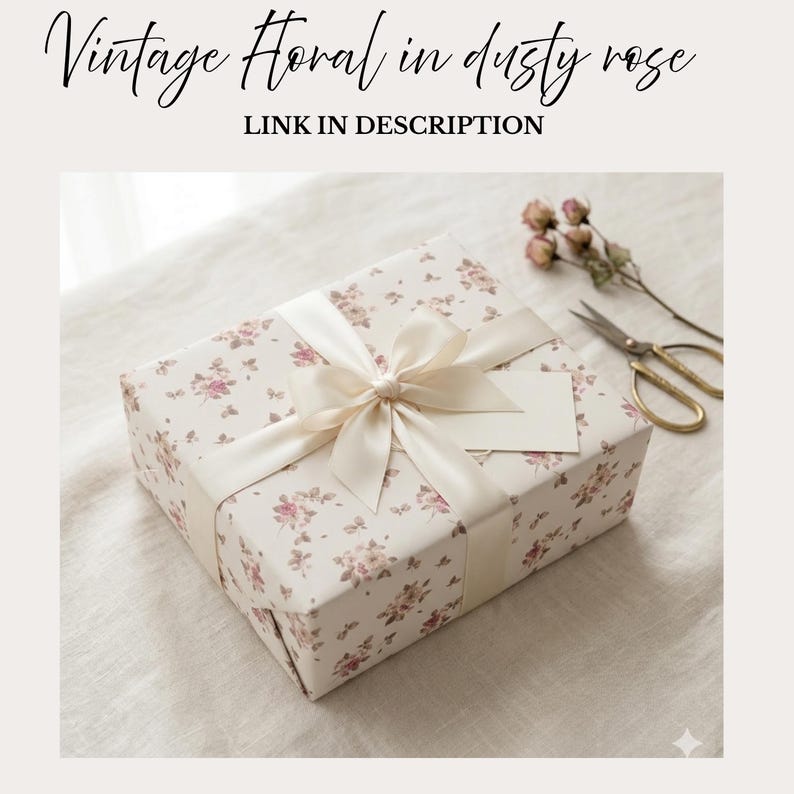 May include: A wrapped gift box with a floral pattern in dusty rose and cream, tied with a cream satin ribbon and bow. A blank tag is attached. The text "Vintage Floral in dusty rose" and "LINK IN DESCRIPTION" is at the top.