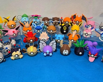 May include: A collection of colorful Pokémon character figures, each with unique designs and features. The figures are arranged on clear display stands against a blue backdrop. The figures include Pikachu, Eevee, and many others.