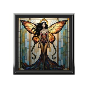 May include: A framed artwork featuring a fantasy figure with butterfly wings. The figure wears a red and gold dress with a long, flowing train. The background is a stained-glass design with a variety of colors, including blue, yellow, and orange.