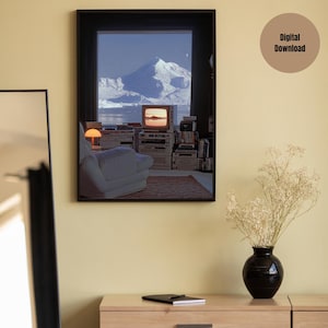 May include: A framed print of a living room interior with a large window overlooking a snowy mountain range. The room features a white armchair, a vintage television, and a collection of electronic equipment. The print has a black frame.