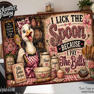 May include: A rectangular sign featuring a cartoon goose wearing a pink polka dot apron and bow, holding a wooden spoon. The text reads I LICK THE SPOON BECAUSE I PAY THE BILLS, along with images of flour and sugar canisters, a mixing bowl, and floral accents in shades of pink and brown.