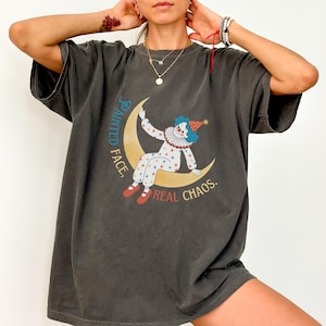 Painted Face Clown Graphic T-Shirt | Funny Retro Chaos Shirt | Circus Aesthetic Tee | Vintage Moon Clown Shirt | Sad Clown Gift Tee