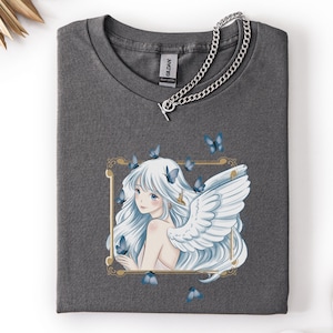 May include: A white ceramic mug with a black handle and the text "But First, Coffee" in a handwritten style. The mug is on a white surface. The mug is likely for hot beverages.