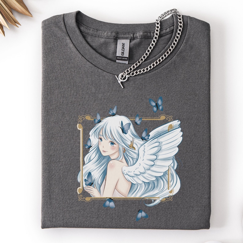 May include: A white ceramic mug with a black handle and the text "But First, Coffee" in a handwritten style. The mug is on a white surface. The mug is likely for hot beverages.