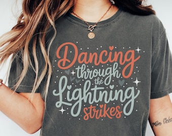 Dancing Through the Lightning Strikes T-Shirt, Inspirational Quote Tee, Pastel Graphic Shirt, Cotton Unisex Top