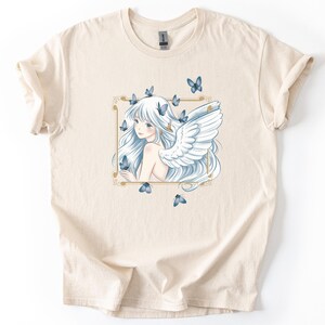 May include: A white ceramic mug with a black handle and the text "But First, Coffee" in a black, handwritten-style font. The mug is on a white surface.