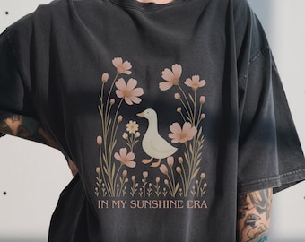 T-shirt canard : t-shirt à imprimé d'oie et de fleurs fantaisistes