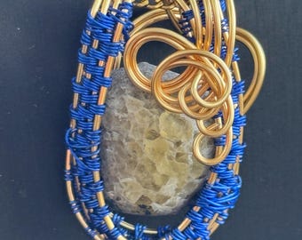 Gold and sapphire blue Fluorite gemstone hancrafted wire wrapped necklace.