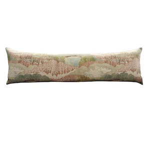 Long linen lumbar pillow showcasing a continuous pastoral landscape pattern with soft blush pink, sage green, cream, and muted blue tones. Inspired by traditional countryside scenery, this decorative lumbar pillow complements English cottage, vintage, grandmillennial, and neutral farmhouse interiors with timeless elegance.