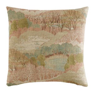 May include: Square decorative pillow with a landscape design. The pillow features a beige background with a pattern of trees, hills, and a body of water in shades of green, brown, and white. The pillow has a textured appearance.