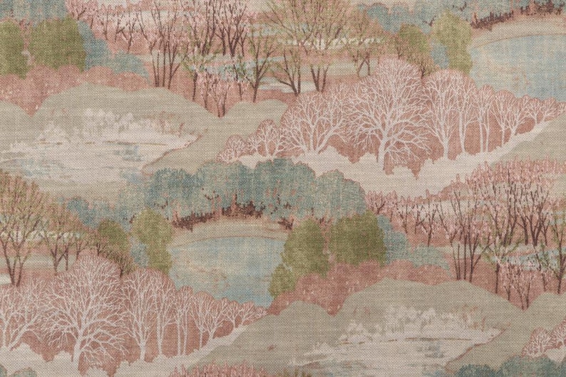 May include: A fabric with a landscape design featuring rolling hills, trees, and bodies of water. The color palette includes shades of pink, green, and blue, creating a serene and naturalistic scene. The trees are depicted with delicate, white branches.