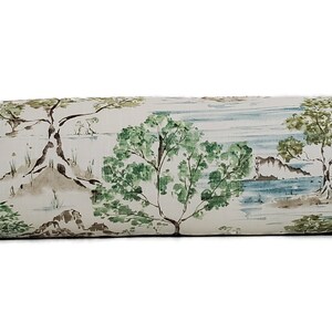 May include: A white bolster cushion with a green and brown landscape print. The print features trees, mountains, and water.