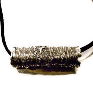 May include: A silver pendant necklace with a textured, cylindrical charm. The charm is wrapped in a silver wire and has a black leather cord.