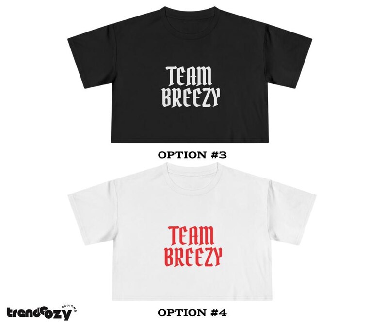 May include: Two cropped t-shirts, one black and one white, each with the text "TEAM BREEZY" in a gothic font. The black shirt has white text, and the white shirt has red text. The shirts are displayed against a white background.