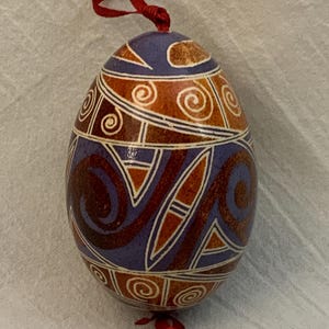 Handcrafted Ukrainian Goose Egg Pysanka – Geometric Swirl Design in Red, Purple & White - With Gift Box
