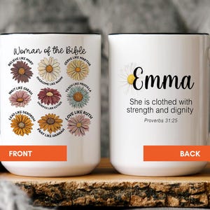 May include: White ceramic mug with a black handle and rim. The front features the text "Woman of the Bible" with floral illustrations and names. The back displays the name "Emma" with a daisy and a Bible verse.