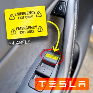 May include: Two yellow warning labels with black text that reads "Emergency Exit Only" with a black exclamation point on each side. The labels are shown next to a black Tesla door handle with a yellow sticker that reads "Emergency Exit Only" on the door panel.