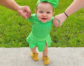 Tinkerbell inspired set in holograph green. This Includes leotard, petal skirt & headband.