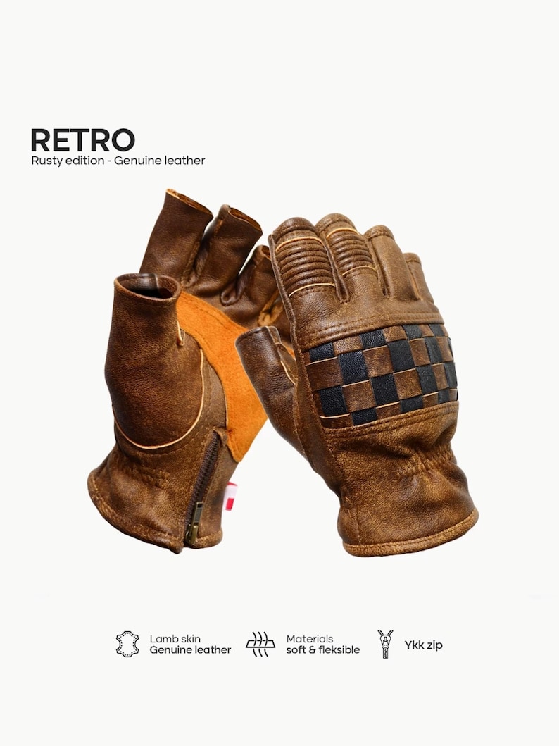 May include: A pair of brown leather fingerless gloves with a checkered pattern on the back of the hand. The gloves are made of lambskin leather and have a YKK zipper on the wrist.