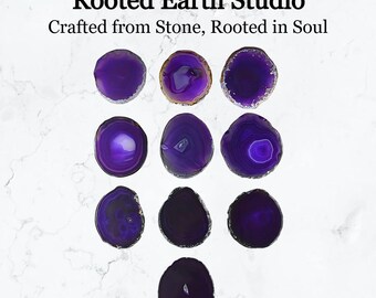 May include: Ten purple agate coasters with a variety of patterns. The coasters are round and have a polished finish. The text "Rooted Earth Studio" and "Crafted from Stone, Rooted in Soul" is visible at the top of the image.