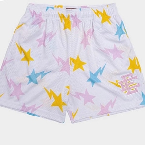 May include: White mesh basketball shorts with a colorful star and lightning bolt pattern. The shorts have a pink, blue, and yellow color scheme. The word "BAPE" is printed on the right leg in pink.