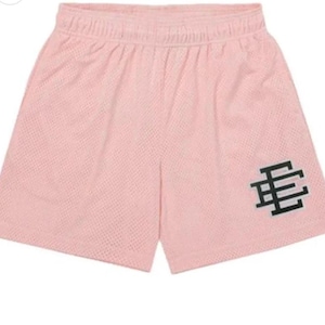 May include: Pink mesh athletic shorts with a black and white logo on the right leg.