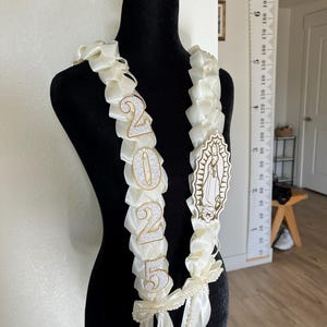 Croquet Virgin Mary graduation lei