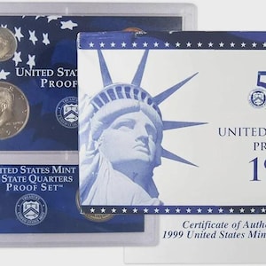 May include: A 1999 United States Mint Proof Set featuring the Statue of Liberty and various coins. The set includes a certificate of authenticity and is packaged in a clear plastic case with a blue background.