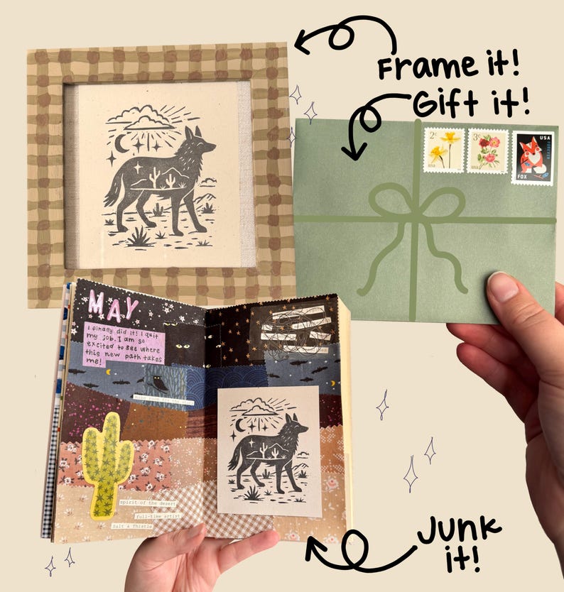 May include: A framed print featuring a black and white illustration of a coyote with a desert landscape. A green envelope with stamps and a bow is held by a hand. A journal with a cactus and the word "MAY" is open.