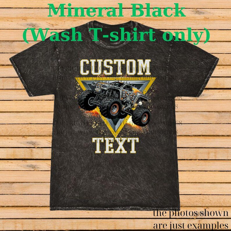 May include: Black mineral wash t-shirt with a custom design. It features a monster truck graphic within a yellow triangle, with the words "CUSTOM" and "TEXT". The shirt is a wash t-shirt.