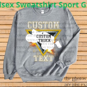 May include: A grey unisex sweatshirt with a custom truck design. The design features a yellow triangle with the word "CUSTOM" above and "TEXT" below. The words "CUSTOM TRUCK" are in the centre. The text "Unisex Sweatshirt Sport Grey" is at the top.