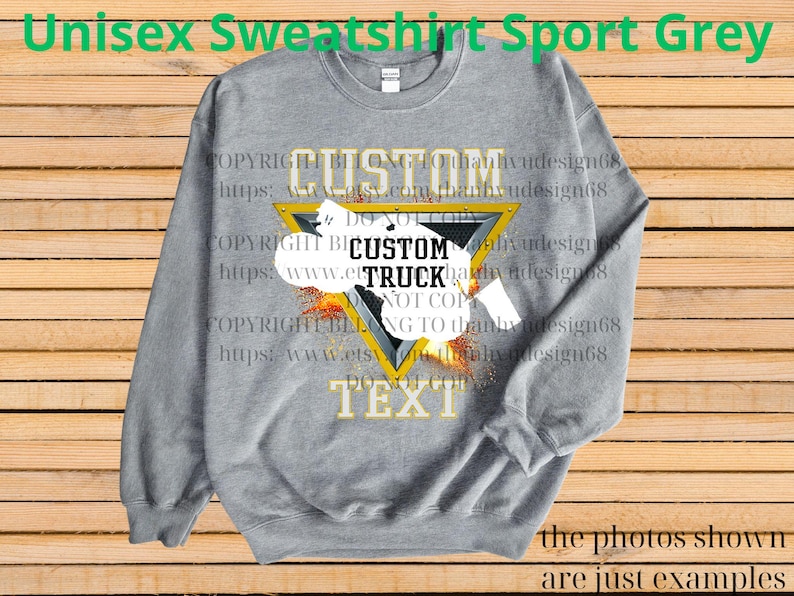 May include: A grey unisex sweatshirt with a custom truck design. The design features a yellow triangle with the word "CUSTOM" above and "TEXT" below. The words "CUSTOM TRUCK" are in the centre. The text "Unisex Sweatshirt Sport Grey" is at the top.