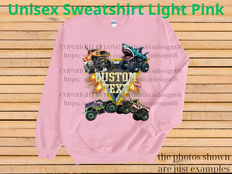 May include: Light pink unisex sweatshirt featuring a graphic of monster trucks in various colors. The design includes the text "CUSTOM TEXT" and the words "Unisex Sweatshirt Light Pink". The photos shown are just examples.