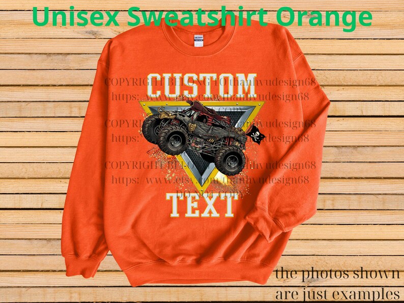 May include: Orange unisex sweatshirt featuring a custom design with a monster truck graphic. The design includes the word "CUSTOM" above the truck and "TEXT" below. The sweatshirt has a crew neck and long sleeves.